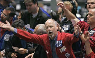 
Trader Brian T. Joenk, center, works in the euro options pit on the Chicago Mercantile Exchange Group trading floor Wednesday, shortly after the Federal Reserve cut a key interest rate a quarter-point. Associated Press
 (Associated Press / The Spokesman-Review)
