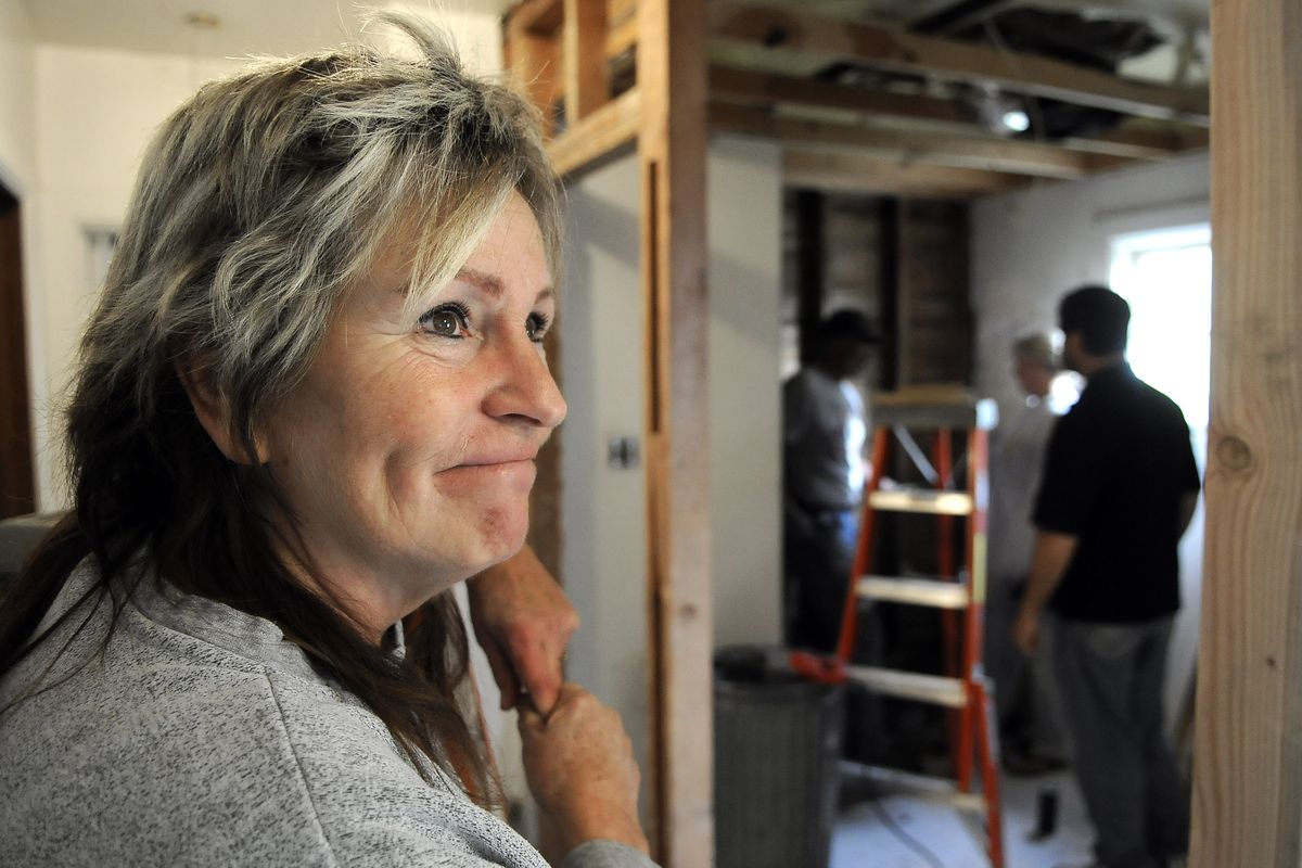 Linda Alderman chokes back tears as she talks about the many volunteers who have helped paint and remodel a 1928 home in Spokane Valley for ALS patient Jenny Hoff. When the house is ready for Hoff, “it’s going to be a real emotional thing,” Alderman said. (Dan Pelle / The Spokesman-Review)