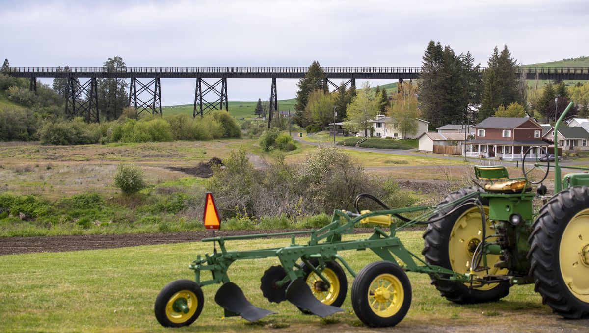 The recently paved and renovated railroad bridge in Tekoa, Washington is now part of the Palouse to Cascades State Park Trail shown Thursday, May 26, 2022. The old bridge goes over Highway 27 as it enters Tekoa.  (Jesse Tinsley/The Spokesman-Review)