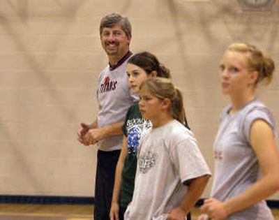 
New University High School volleyball coach Mark Weis watches his team practice during a summer workout, Tuesday. 
 (J. BART RAYNIAK / The Spokesman-Review)