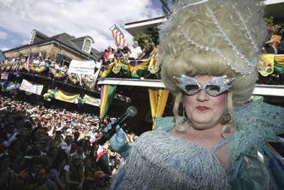 
Blanche Debris hosts the Bourbon Street Awards costume contest in the French Quarter of New Orleans during Tuesday's Mardi Gras celebrations. 
 (Associated Press / The Spokesman-Review)