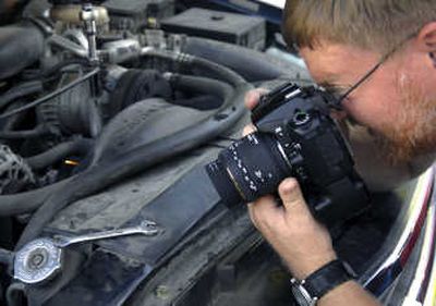Steve Degenhardt photographs parts inside his truck for a stock photography Web site. Degenhardt uses increasingly popular microstock Web sites to sell his photos.
(Holly Pickett / The Spokesman-Review)