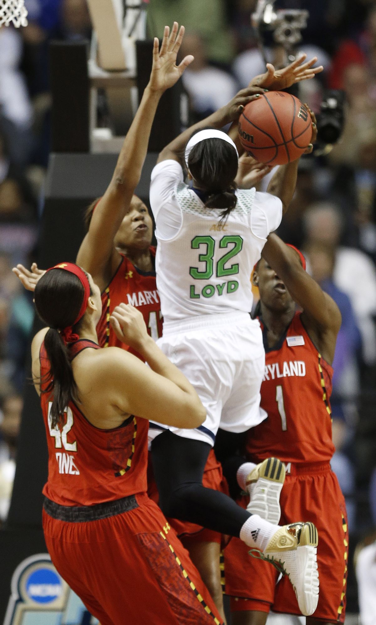 Notre Dame guard Jewell Loyd shoots against Maryland center Brionna Jones (42) and Maryland guard Laurin Mincy (1) during the second half of Notre Dame’s victory over the Terrapins. Story, page B5 (Associated Press)