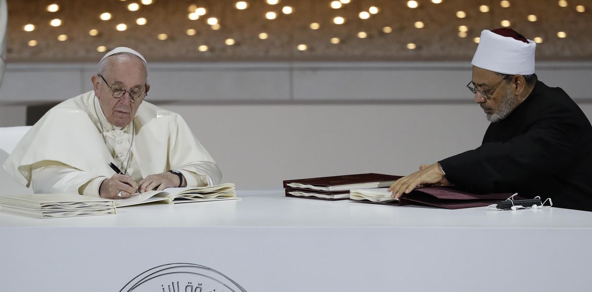 Pope Francis, left, and Sheikh Ahmed el-Tayeb, the grand imam of Egypt’s Al-Azhar, sign a declaration after an Interreligious meeting at the Founder’s Memorial in Abu Dhabi, United Arab Emirates, Monday, Feb. 4, 2019. Pope Francis has asserted in the first-ever papal visit to the Arabian Peninsula that religious leaders have a duty to reject all war and commit themselves to dialogue. (Andrew Medichini / Associated Press)