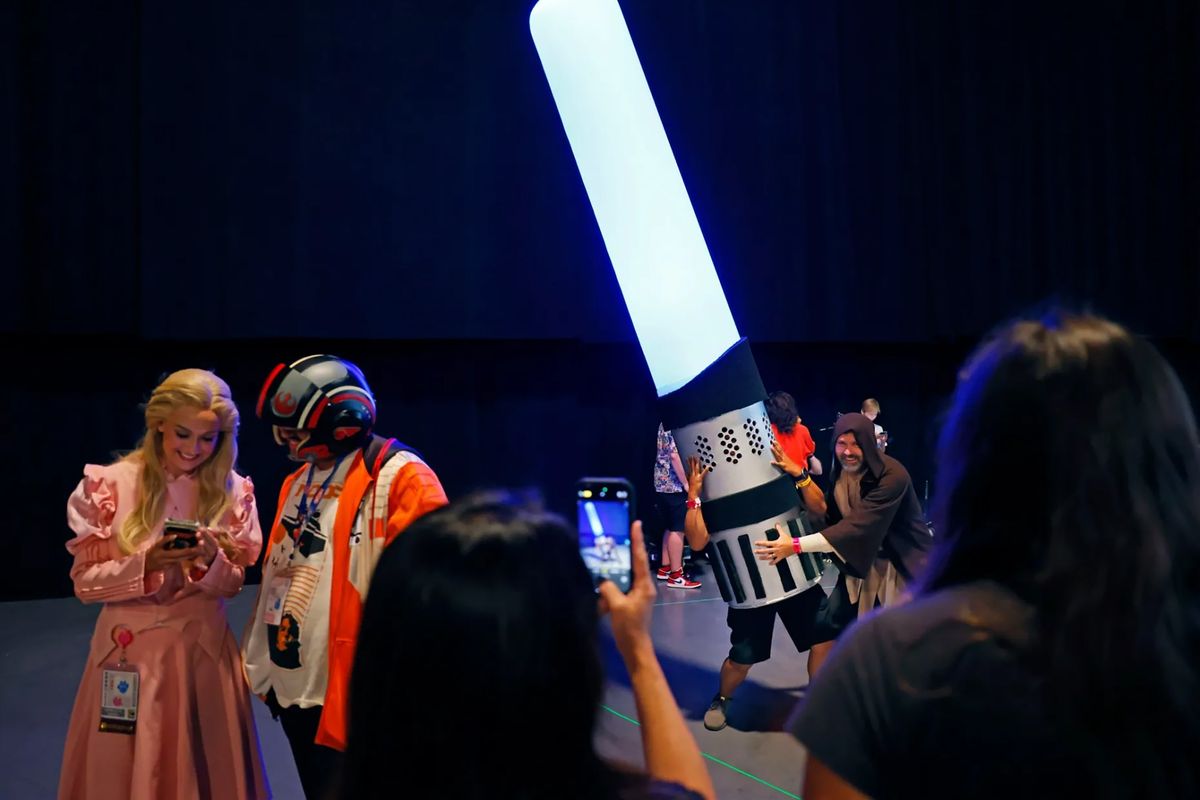 A fan dressed as a giant lightsaber at the Sneak Peek: Lucas Museum Of Narrative Art panel during Comic-Con International on July 27, 2025, in San Diego. (K.C. Alfred/The San Diego Union-Tribune/TNS)