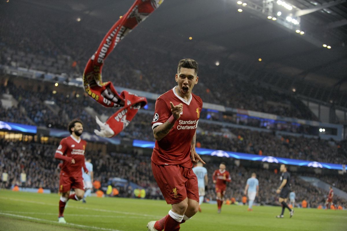 Liverpool’s Roberto Firmino celebrates scoring his side’s second goal during the Champions League quarterfinal second leg soccer match between Manchester City and Liverpool at Etihad stadium in Manchester, England, Tuesday, April 10, 2018. (Rui Vieira / Associated Press)