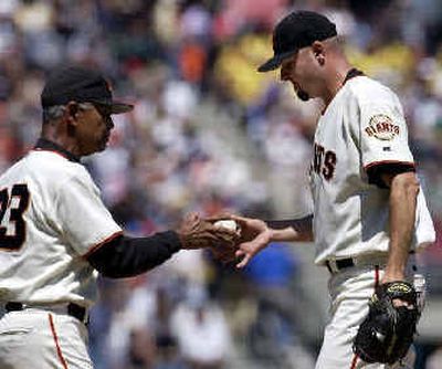 
Jason Schmidt submits to San Francisco Giants manager Felipe Alou, ending his winning streak at 12. 
 (Associated Press / The Spokesman-Review)