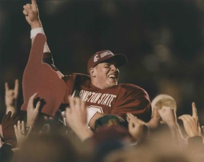 Washington State quarterback Ryan Leaf celebrates with fans after a game in 1997.  (Spokesman-Review files)