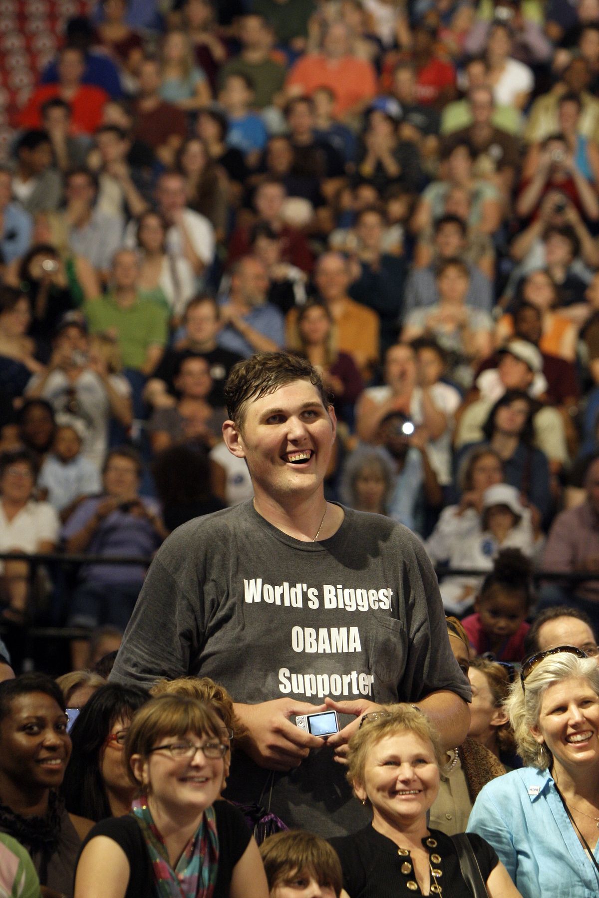 FILE - In this Sept. 12, 2009 file photo, Igor Vovkovinskiy, 27, of Rochester, Minn, standing 7-feet and 8-inches tall, listens to President Barack Obama, not pictured, during a health insurance reform rally in Minneapolis. Vovkovinskiy, the tallest man in the United States, has died in Minnesota. He was 38. His family says the Ukrainian-born Vovkovinskiy died of heart disease Friday, Aug. 20, 2021, at the Mayo Clinic in Rochester. (Haraz N. Ghanbari)