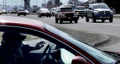 A motorist waits for the light to change at the intersection of U.S. Highway 95 and Bosanko Avenue in Coeur d’Alene on Thursday.  (Kathy Plonka / The Spokesman-Review)