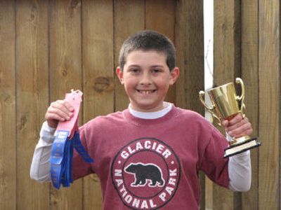 Brooks Urbiha with two of his Interstate Fair gardening awards. Photo by Frank Cruz-Aedo
 (Photo by Frank Cruz-Aedo / The Spokesman-Review)