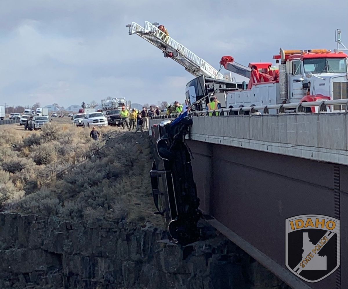 Authorities say a set of camp trailer safety chains and quick, careful work by emergency crews saved two people after their pickup truck plunged off a bridge, leaving them dangling above a deep gorge Monday in southern Idaho.  (HOGP)