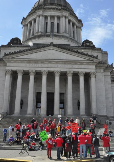 Members of the Poker Players Alliance gather on the steps of the Capitol Thursday after the Supreme Court heard arguments against the state's law banning Internet gambling. (Jim Camden, Spokesman-Review)