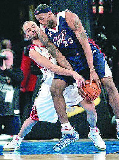 
Western player Tony Parker defends against the East's LeBron James. 
 (Associated Press / The Spokesman-Review)