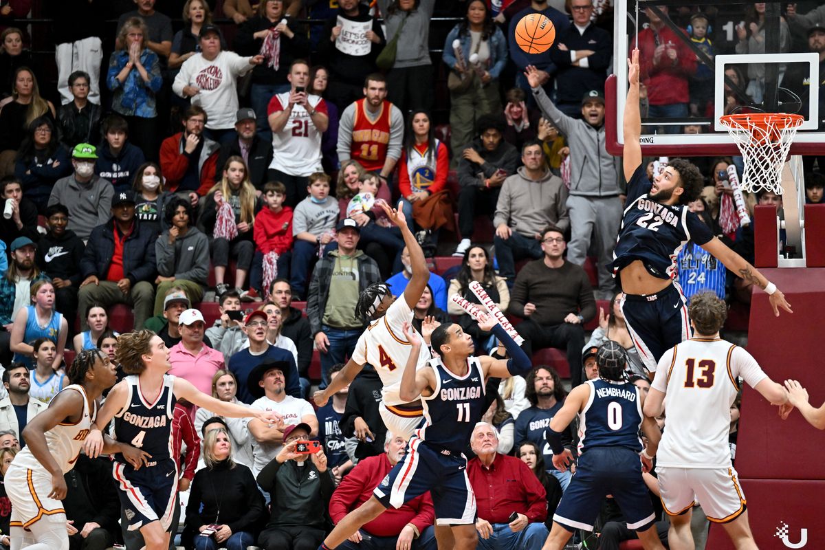 Gonzaga Bulldogs forward Anton Watson (22) leaps in attempt to block the shot of Santa Clara Broncos guard Adama Bal (4) during the second half of a college basketball game on Thursday, Jan. 11, 2024, at the Leavey Center in Santa Clara, Calif. Gonzaga lost the game 77-76.  (Tyler Tjomsland/The Spokesman-Review)
