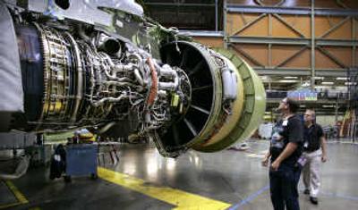 
Employees look at an engine of a Boeing 767 cargo plane. Boeing hopes to win back a contract to replace aerial refueling tankers for the Air Force. Associated Press
 (Associated Press / The Spokesman-Review)