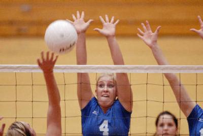 
La Conner's Carlee Marble blocks a Wilbur-Creston hit during Saturday's State 2B volleyball title at Eastern Washington University. 
 (Ingrid Lindemann / The Spokesman-Review)