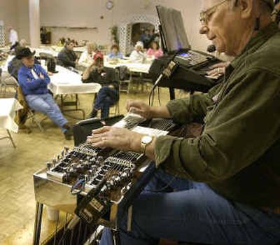 
Darrell Klein plays a gospel song accompanying his wife, Carol, at a benefit Saturday to raise money for Don Parks, who has cancer and is undergoing treatment. 
 (Jesse Tinsley / The Spokesman-Review)