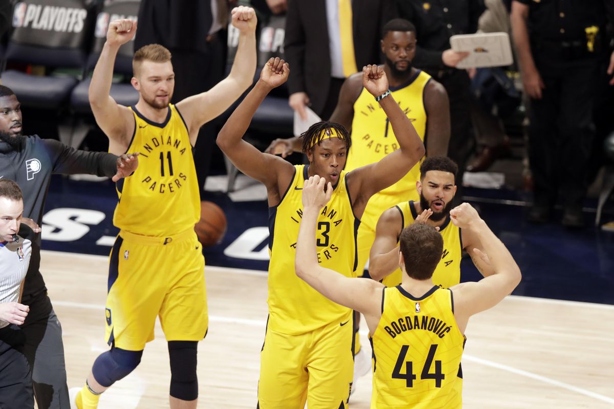 Indiana Pacers forward Bojan Bogdanovic (44), center Domantas Sabonis (11), center Myles Turner (33) and guard Lance Stephenson (1) celebrate after the Pacers won Game 3 of an NBA basketball first-round playoff series against the Cleveland Cavaliers in Indianapolis, Friday, April 20, 2018. The Pacers won 92-90 to take a 2-1 lead in the series. (Michael Conroy / Associated Press)