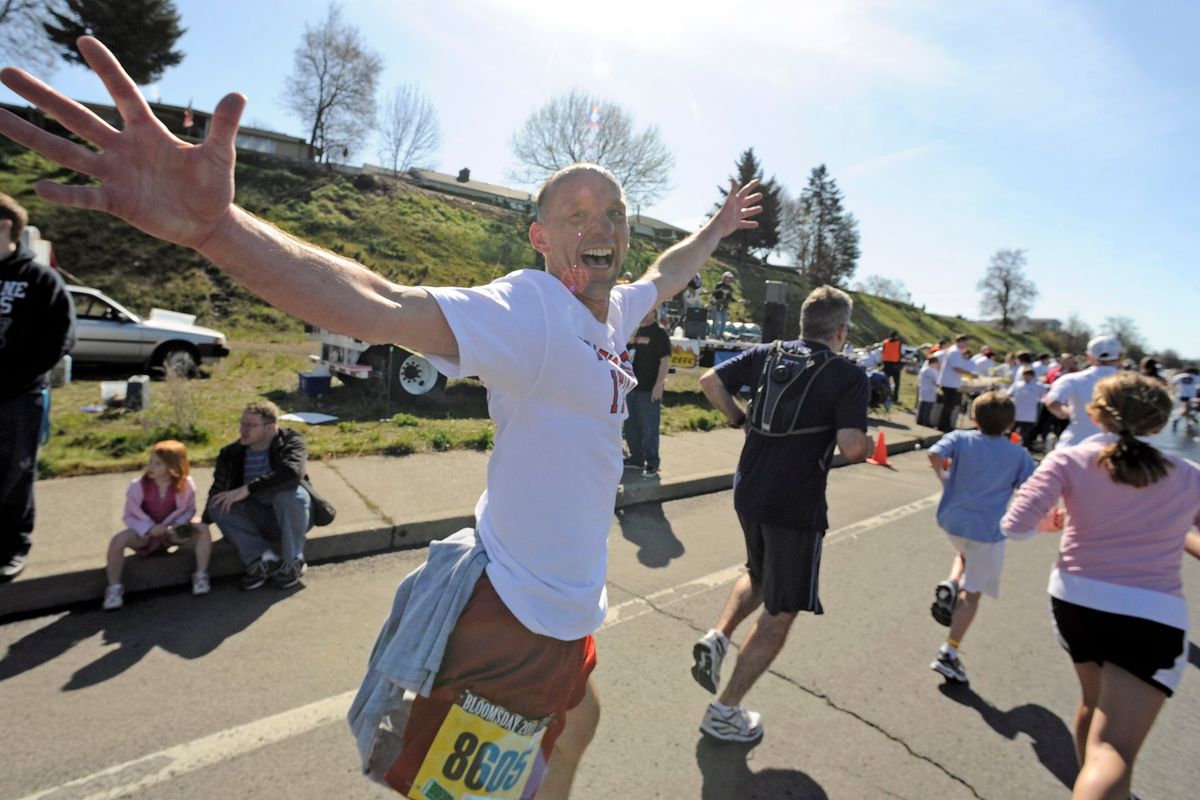 Dave Cook, Sports Information Director at EWU, is fresh and still running at the top of Doomsday Hill during the 2011 Bloomsday on May 1, 2011.  (CHRISTOPHER ANDERSON)