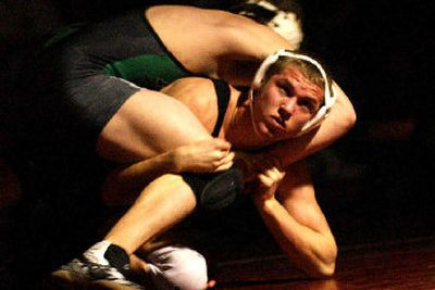 
University's Danny Jordan, 160 pounds, looks to the bench en route to a win over East Valley wrestler Dakota Lawson in one of the top matchups of Wednesday's match at U-Hi. 
 (Brian Plonka / The Spokesman-Review)