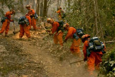 
California Department of Corrections inmates cut a 6-foot-wide fire break on the Orr fire in Mendocino County.Associated Press
 (Associated Press / The Spokesman-Review)