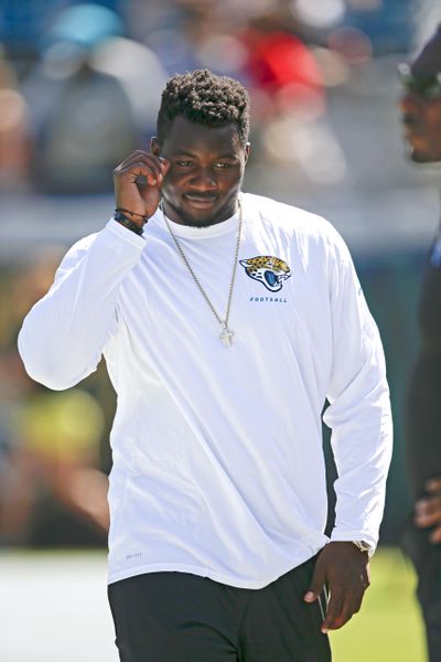 In this Sunday, Sept. 20, 2015 photo, Jacksonville Jaguars defensive end Dante Fowler Jr. watches teammates warm up before of an NFL football game against the Miami Dolphins in Jacksonville, Fla. The NFL said video of Fowler apparently refereeing a fight between his girlfriend and the mother of his child includes
