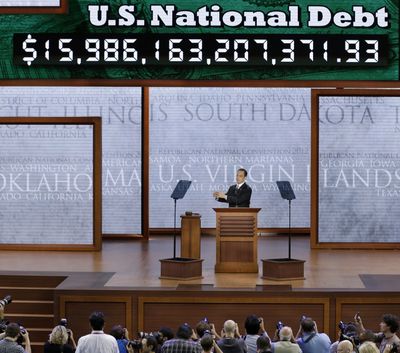 Republican National Committee Chairman Reince Priebus announces the display of the debt ticker during the Republican National Convention in Tampa, Fla. (Associated Press)
