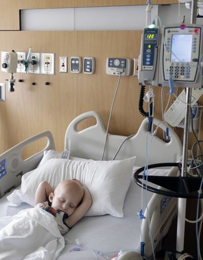 Landon Kimich, 2, sleeps as he receives a chemotherapy treatment for neuroblastoma at Houston’s MD Anderson Cancer Center on May 22. (Associated Press)