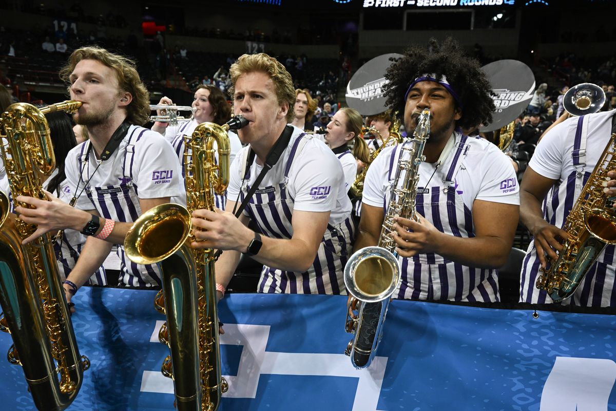 Saxophonists Lukas Carlson, Jeffrey Ciccarelli and Andrew Eversley perform with the Thundering Heard Pep Band of Grand Canyon University on Sunday inside the Arena asGrand Canyon played Alabama in the second round of the NCAA Tournament.  (Jesse Tinsley/THE SPOKESMAN-REVIEW)