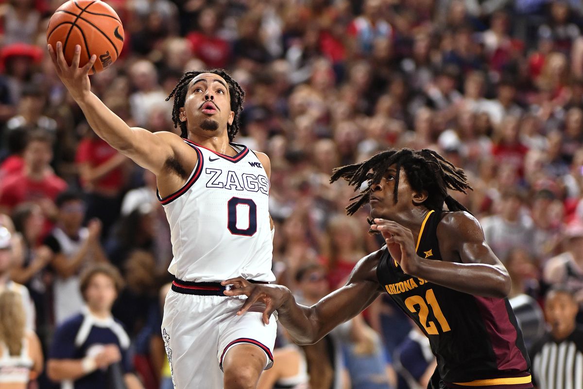 Gonzaga’s Ryan Nembhard, left, eyes the basket as Arizona State’s Jayden Quaintance defends on Sunday at McCarthey Athletic Center. Nembhard had 13 points, 11 assists and no turnovers in the win.  (Colin Mulvany / The Spokesman-Review)