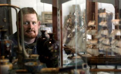 
Jeremy Lenhartzen with items from estate sales. 
 (The Spokesman-Review)