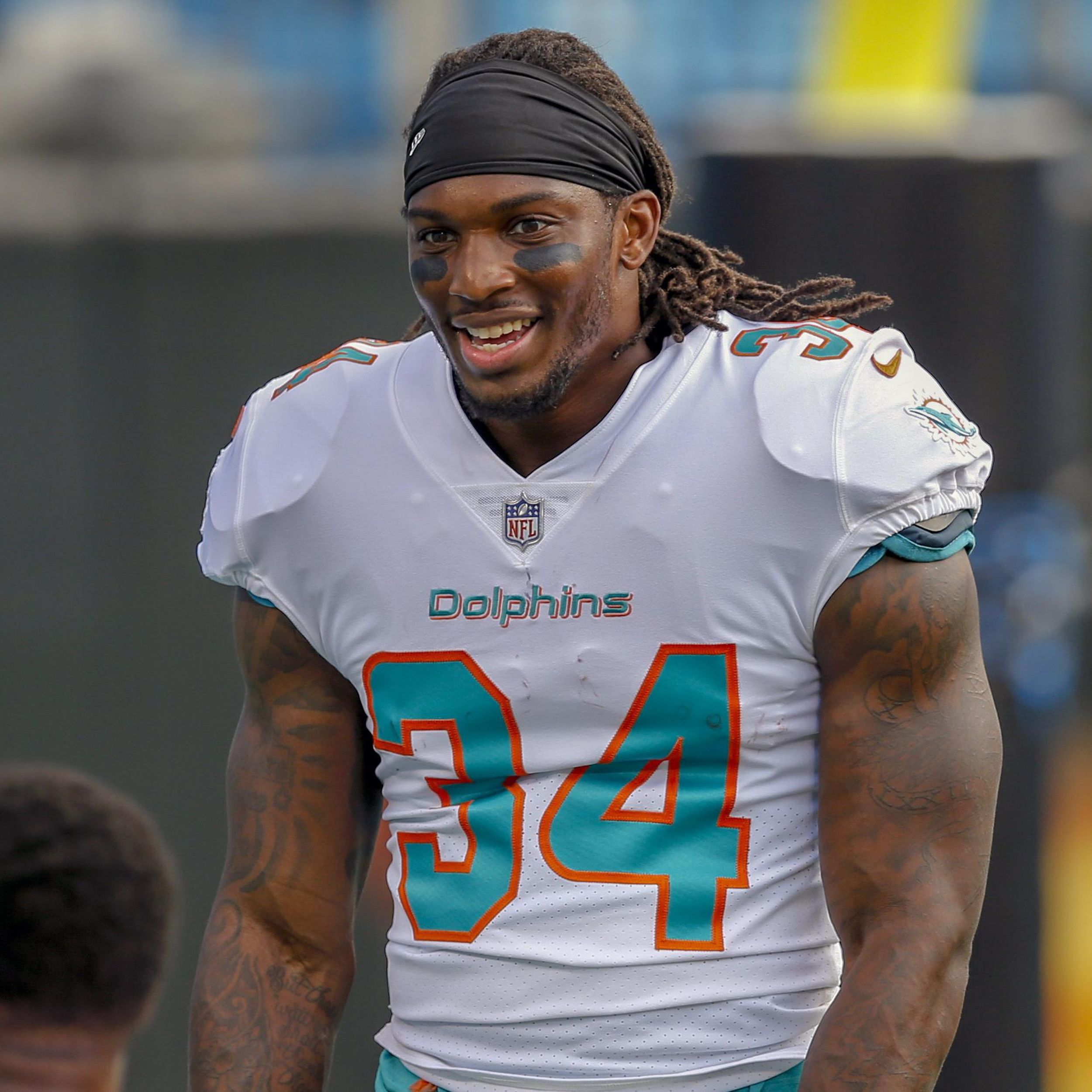 Miami Dolphins running back Senorise Perry (34) walks back to the