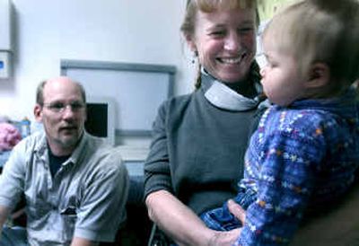 
Dr. Leanne Rousseau holds Madison Merica before an appointment with Madison's dad, Don Merica, at Dirne Community Health Center in Coeur d'Alene. 
 (Kathy Plonka / The Spokesman-Review)