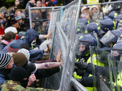 
Protesters clash with police Wednesday at the security fence surrounding the G-8 summit in Gleneagles, Scotland.
 (Associated Press / The Spokesman-Review)