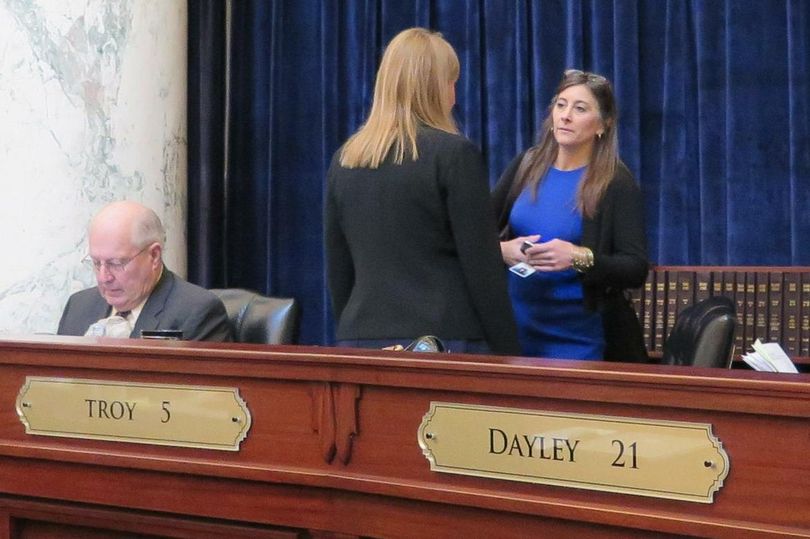 Rep. Heather Scott, R-Blanchard, right, talks with Rep. Caroline Nilsson Troy, R-Genesee, on the floor of the Idaho House on Thursday morning. (Betsy Z. Russell / The Spokesman-Review)