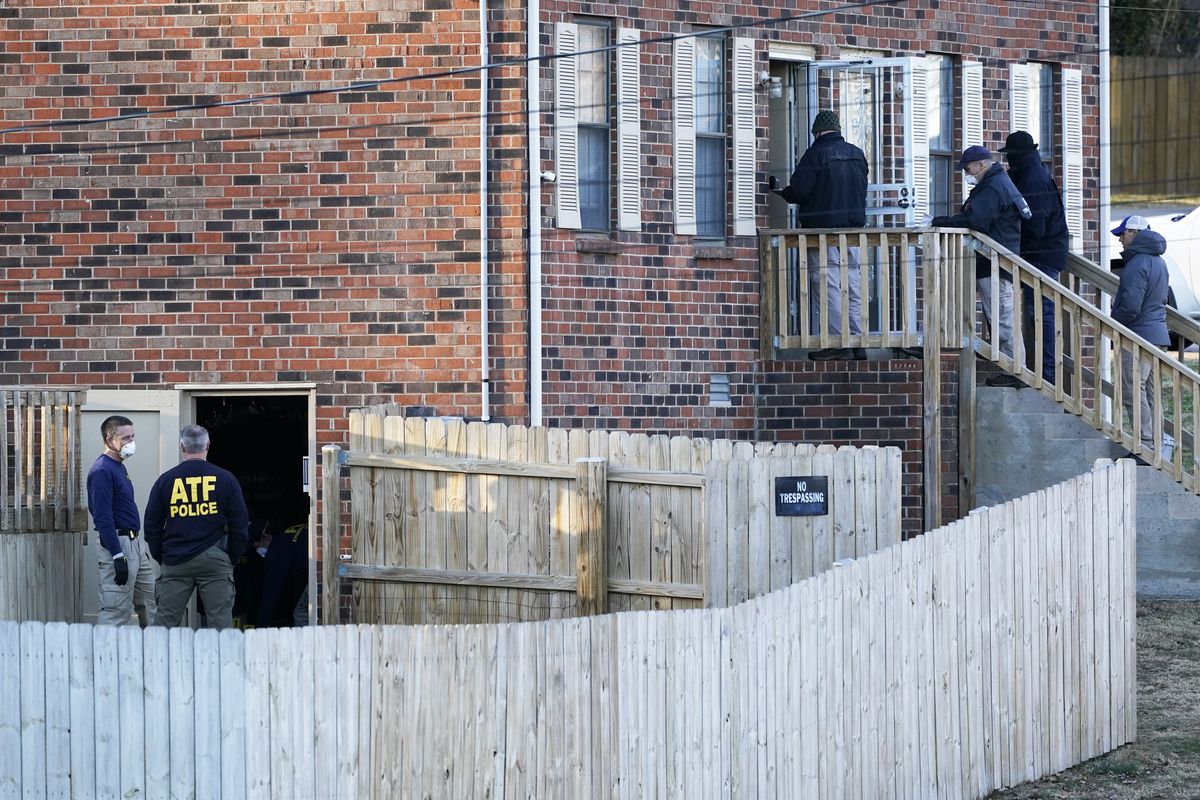 FBI and ATF agents investigate a home Saturday, Dec. 26, 2020, in Nashville, Tenn. An explosion that shook the largely deserted streets of downtown Nashville early Christmas morning shattered windows, damaged buildings, and wounded three people. Authorities said they believed the blast was intentional. (Mark Humphrey)