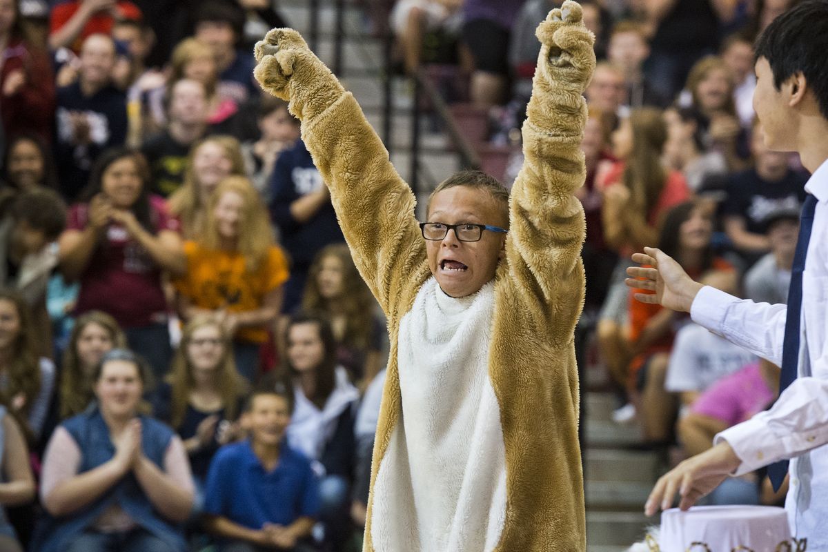 Mt. Spokane High School senior Lucas Morgan, wearing the school’s Wildcat mascot costume, realizes he was just announced as homecoming king during an assembly Friday in the school’s gym. Morgan, who has leukemia and Down syndrome, was elected by the student body. (Dan Pelle)