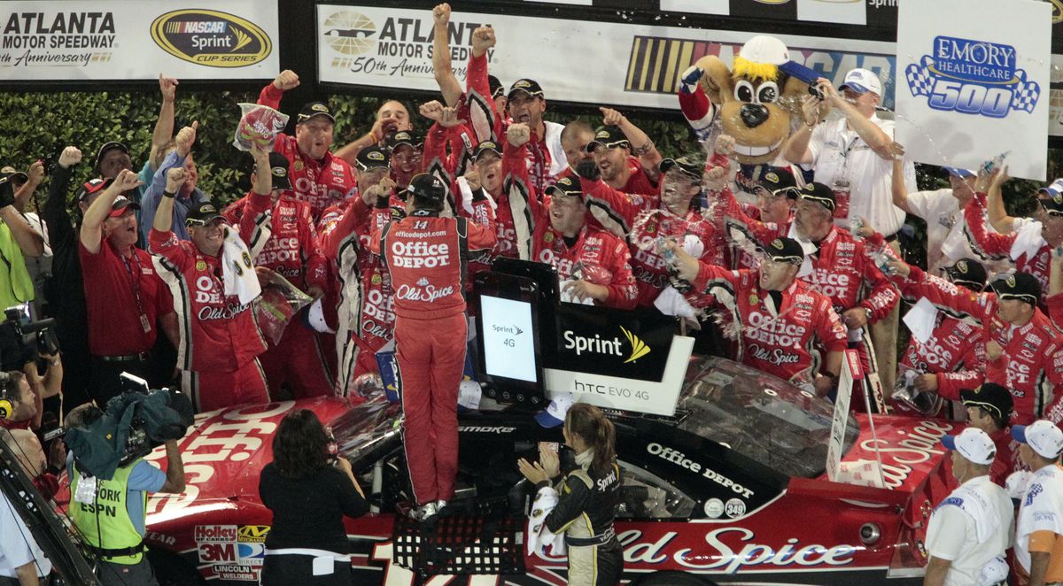 Tony Stewart, his team and his supporters enjoy their trip back to Victory Lane. (Associated Press)
