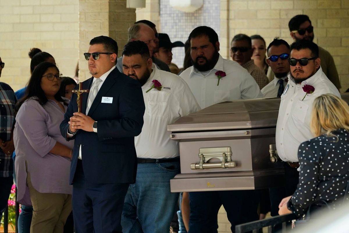 Pallbearers carry the casket of Amerie Jo Garza following funeral services at Sacred Heart Catholic Church, Tuesday, May 31, 2022, in Uvalde, Texas. Garza was killed in last week’s elementary school shooting,  (Eric Gay)