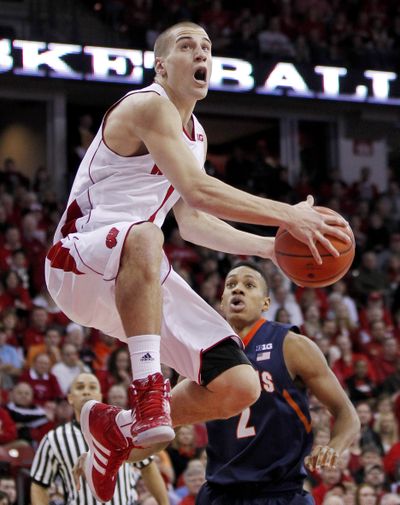 Wisconsin’s Ben Brust beats Illinois’ D.J. Richardson to the basket during second-half play on Saturday. (Associated Press)