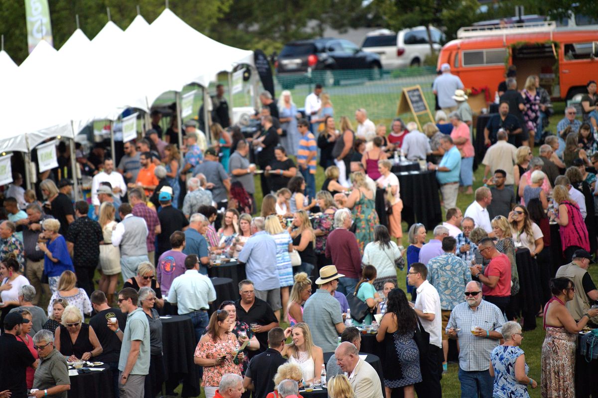 Attendees enjoy Crave Food and Drink Celebration’s Seafood Bash on Thursday, July 11, 2019, at CenterPlace Regional Event Center in Spokane Valley. (Tyler Tjomsland / The Spokesman-Review)