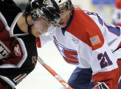 Spokane’s Ondrej Roman, right, gets ready for a faceoff with Vancouver Giants’ Mikhail Fisenko in a meeting at the Arena in February.  (Jesse Tinsley / The Spokesman-Review)