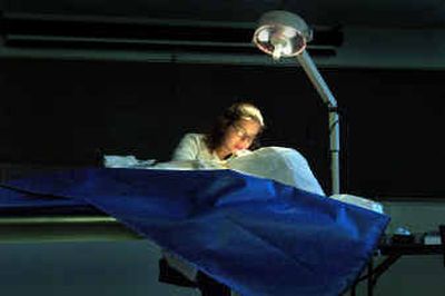 WSU graduate Emily Squyer prepares a cadaver for dissection in the anatomy lab on the Pullman campus on Wednesday.
(Christopher Anderson/ / The Spokesman-Review)