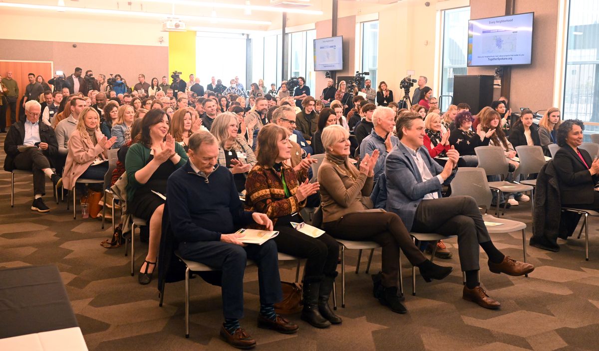 Residents, media and supporters listen to a talk about the benefits that Spokane’s schools and parks would see if voters pass the proposed initiative between the Parks Department and Spokane Schools to renovate and integrate parks and school properties under a new proposal presented to a crowd Thursday at the Hive.  (Jesse Tinsley/THE SPOKESMAN-REVIEW)