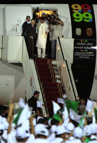 ORG XMIT: XAN115 **  RETRANSMISSION FOR ALTERNATE CROP  **  Libyan Abdel Baset al-Megrahi, top, left, using stick, who was found guilty of the 1988 Lockerbie bombing, is accompanied by Seif al-Islam el- Gadhafi, son of Libyan leader Libyan leader Moammar Gadhafi upon his arrival at an airport in Tripoli, Libya, Thursday, Aug. 20, 2009.  Scotland freed the terminally ill Lockerbie bomber on compassionate grounds Thursday, allowing him to die at home in Libya despite American protests that mercy should not be shown to the man responsible for the deaths of 270 people. (AP Photo/ Amr Nabil) (Amr Nabil / The Spokesman-Review)