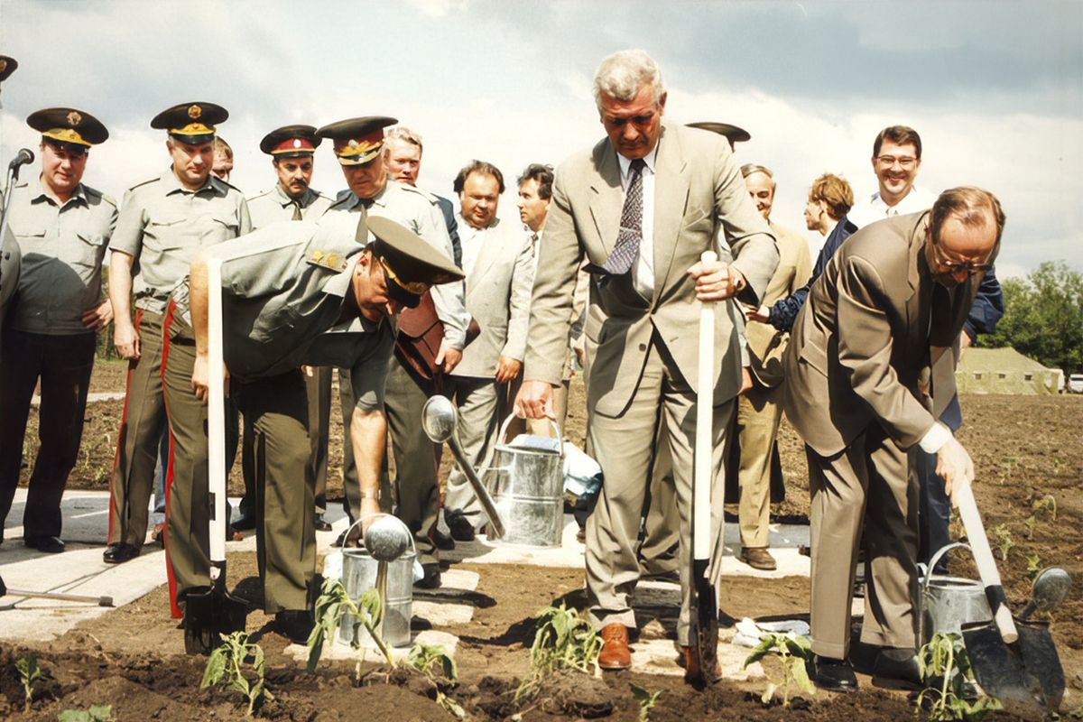 This June 4, 1996, photo provided by William Perry, shows, from left, Russian defense minister Pavel Grachev, Ukrainian Defense Minister Valery Schmarov, and U.S. Defense Secretary William Perry planting sunflowers at the site which formerly housed a missile silo at a military base near Pervomaysk, some 155 miles south of Kyiv, Ukraine.  (HOGP)