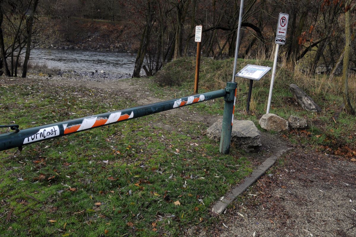 A locked gate prohibits drift boaters and heavy rafts with trailers from accessing the city-owned launch at Water Street on the Spokane River. (J. BART RAYNIAK)