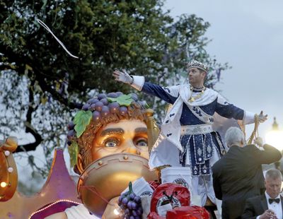 Bacchus LI, actor Jensen Ackles, throws to the crowd as the 1,600 men of Bacchus present their 32-float Mardi Gras parade entitled “Starring Louisiana” on the Uptown route in New Orleans on Sunday, March 3, 2019. (Michael DeMocker / associated press)