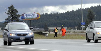 Washington State Patrol investigators examine the scene Thursday. (Jesse Tinsley / The Spokesman-Review)